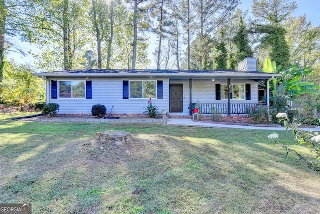 ranch-style home with a front yard and covered porch