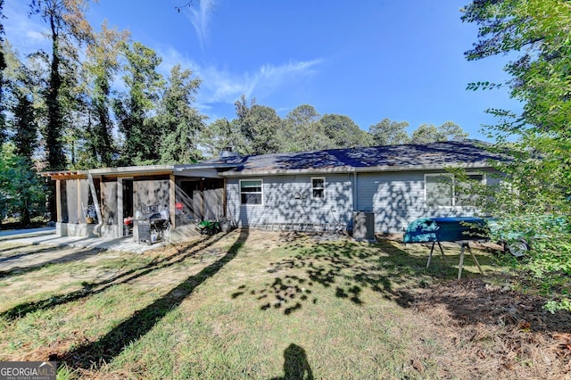 rear view of house with a patio