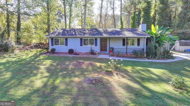 single story home featuring a front lawn and covered porch