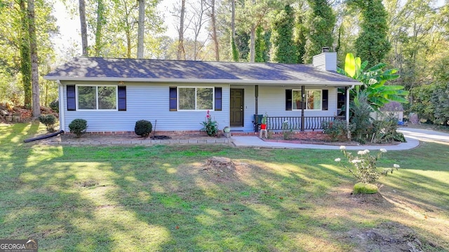 ranch-style house with covered porch and a front lawn