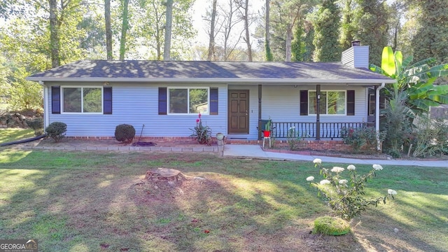 ranch-style house with a front yard and a porch