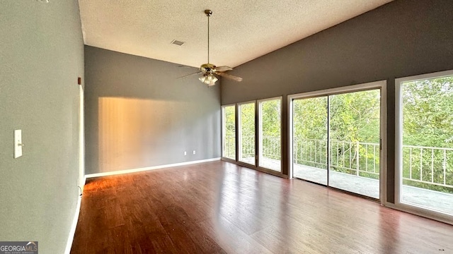 unfurnished room with a textured ceiling, wood-type flooring, ceiling fan, and high vaulted ceiling