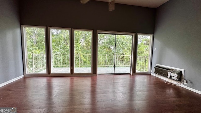 unfurnished sunroom with vaulted ceiling with beams and plenty of natural light