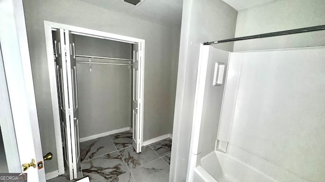 bathroom featuring washtub / shower combination