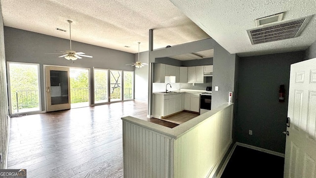 kitchen featuring ceiling fan, white cabinets, sink, white electric range, and hardwood / wood-style floors