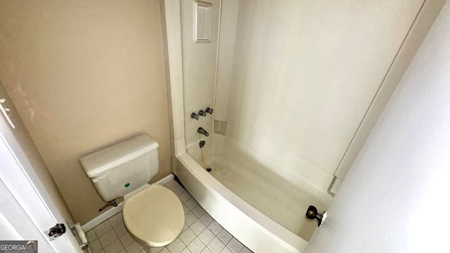 bathroom with tile patterned flooring, toilet, and shower / bath combination