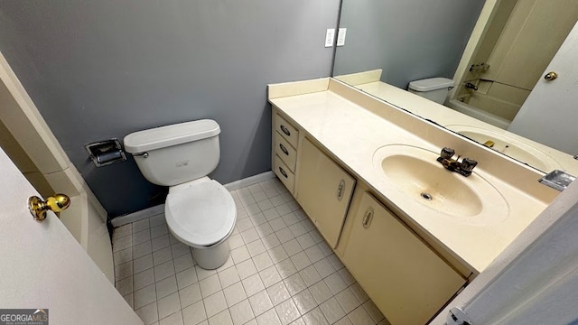 bathroom featuring vanity, toilet, and tile patterned floors