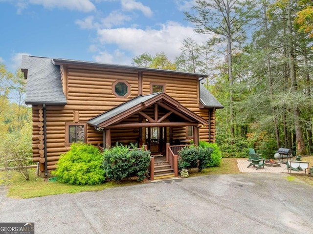 log cabin with covered porch