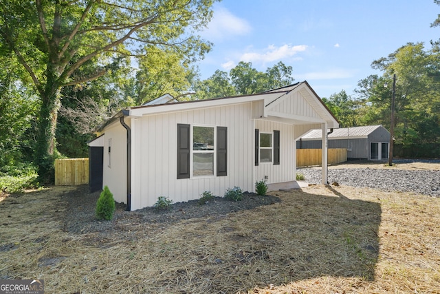 modern inspired farmhouse with a storage shed