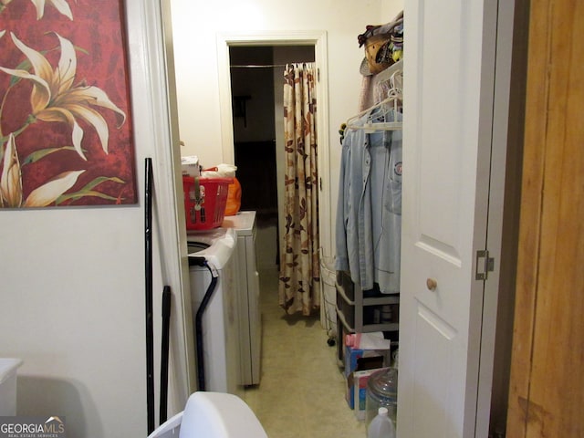 clothes washing area with independent washer and dryer