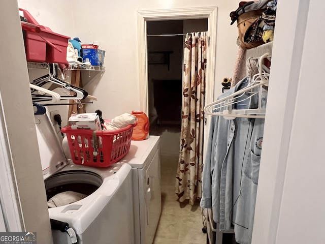 clothes washing area featuring washer and clothes dryer