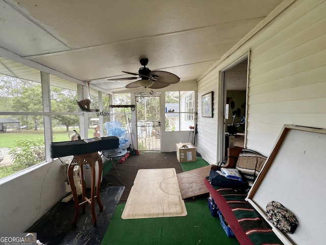 sunroom / solarium with ceiling fan and plenty of natural light