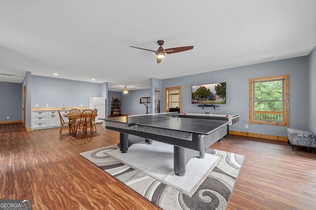 rec room with wood-type flooring and ceiling fan