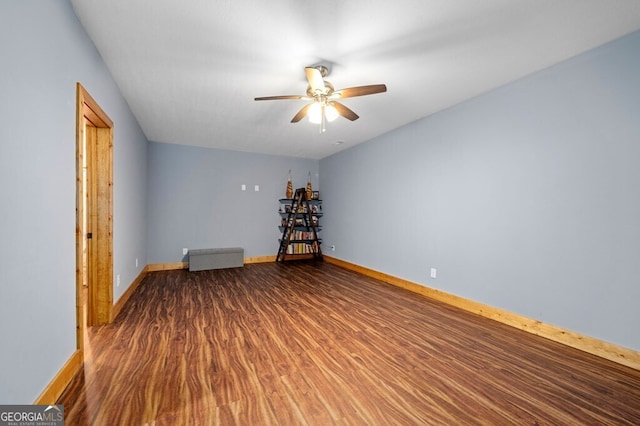 spare room with wood-type flooring and ceiling fan