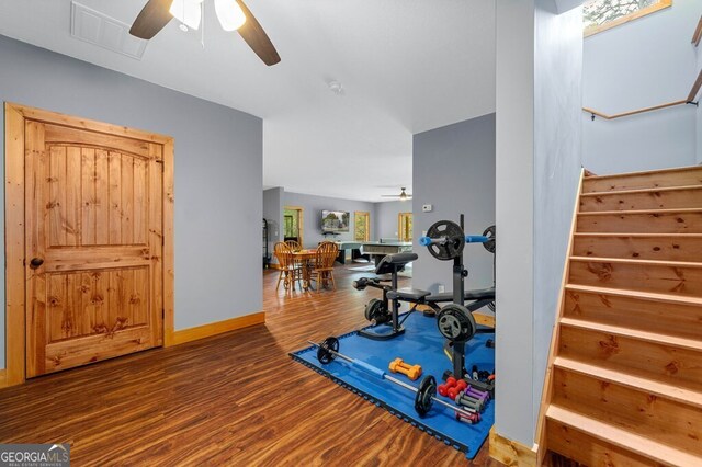 workout room featuring wood-type flooring and ceiling fan