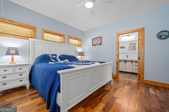 bedroom featuring ceiling fan, dark wood-type flooring, and sink