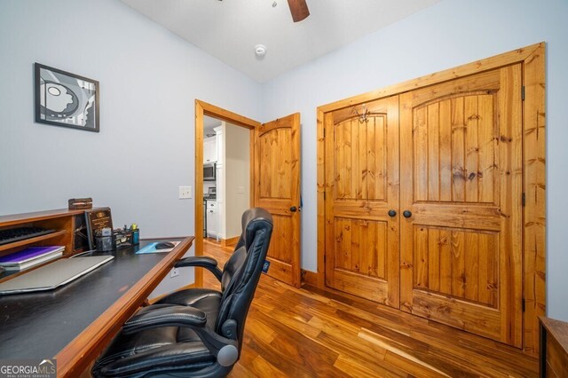 office area with ceiling fan and hardwood / wood-style flooring