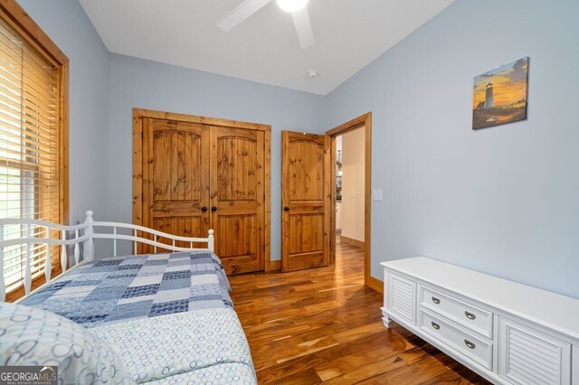 bedroom featuring dark hardwood / wood-style flooring and ceiling fan