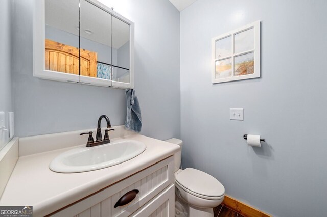 bathroom with vanity and toilet