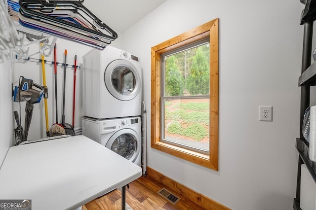 292 Silver Fox Trl, Blue Ridge, GA 30513 - laundry area featuring stacked washer / dryer, wood finished floors, and baseboards