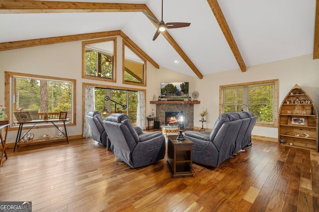 292 Silver Fox Trl, Blue Ridge, GA 30513 - living room with hardwood / wood-style flooring, beam ceiling, a lit fireplace, high vaulted ceiling, and a ceiling fan