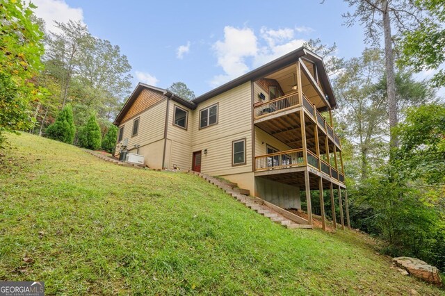 292 Silver Fox Trl, Blue Ridge, GA 30513 - back of property featuring a lawn, a wooden deck, stairway, and a balcony