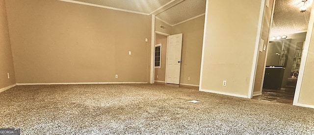 carpeted empty room with lofted ceiling