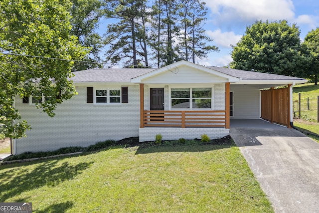 single story home featuring a carport and a front yard