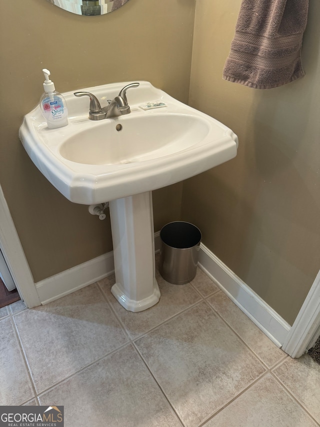 bathroom with tile patterned floors and sink