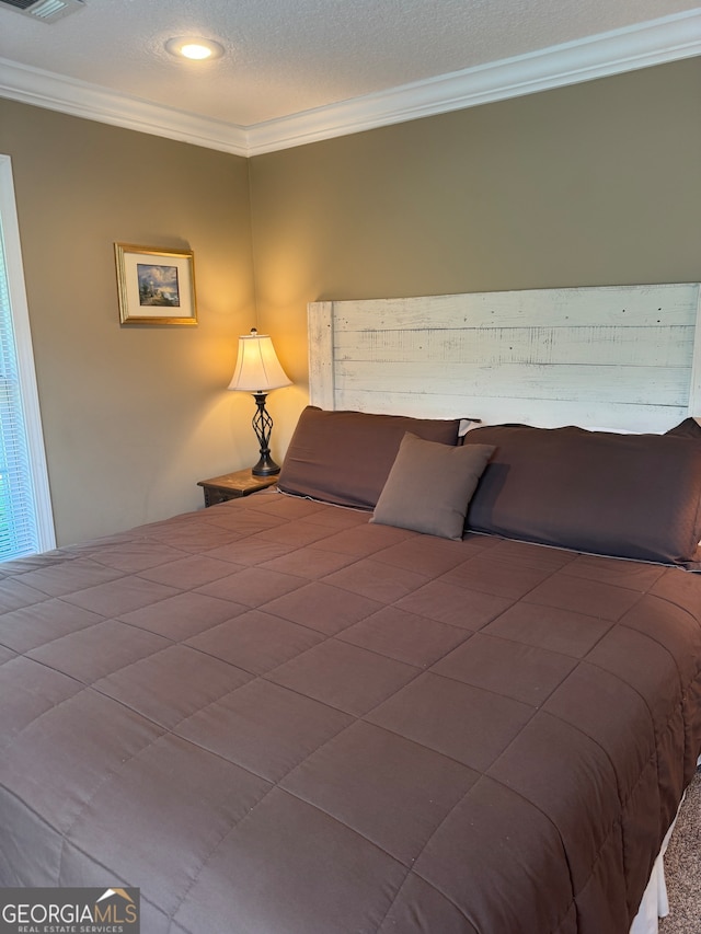 carpeted bedroom with crown molding