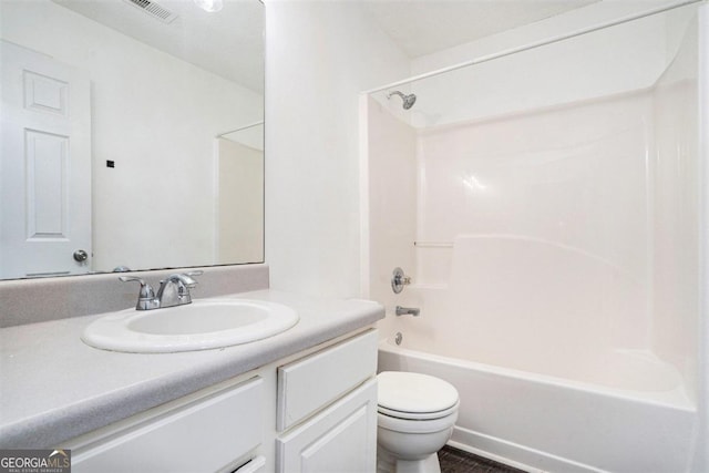 full bathroom featuring vanity, tub / shower combination, and toilet