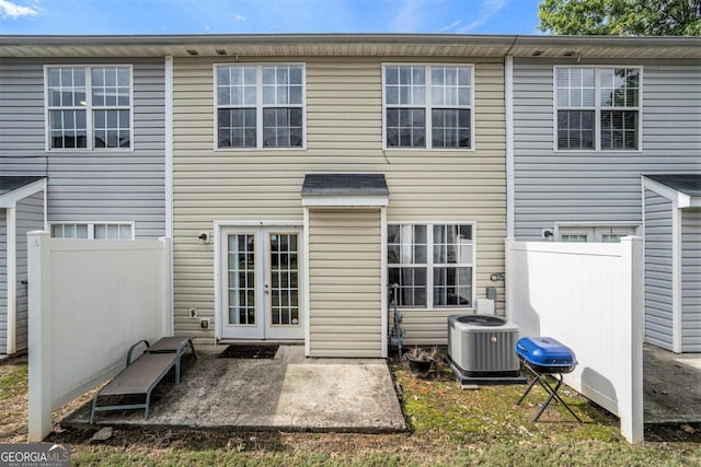 rear view of property featuring central air condition unit