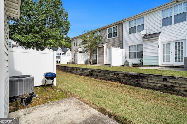 view of yard featuring cooling unit and a patio area