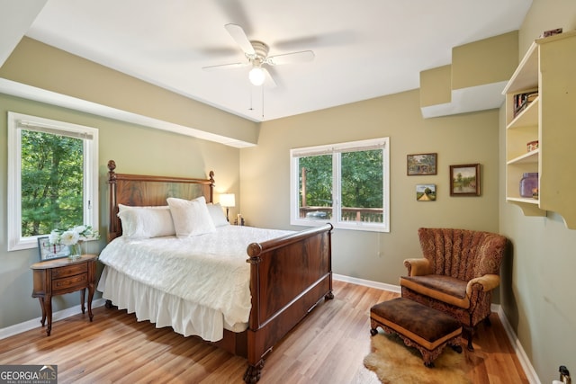 bedroom featuring light hardwood / wood-style floors and ceiling fan