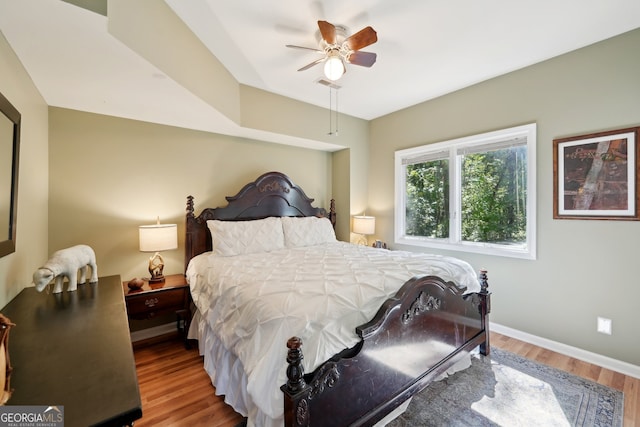 bedroom featuring ceiling fan and hardwood / wood-style flooring