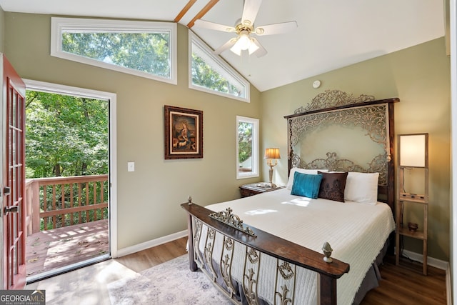 bedroom featuring multiple windows, hardwood / wood-style floors, ceiling fan, and high vaulted ceiling