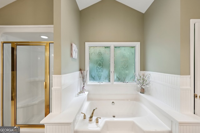 bathroom featuring shower with separate bathtub and lofted ceiling