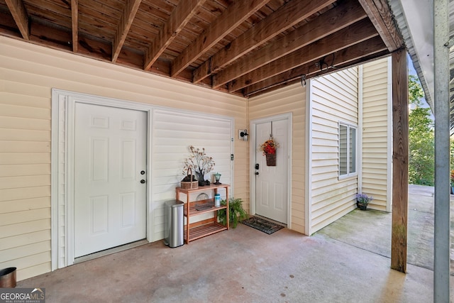 doorway to property with a patio area