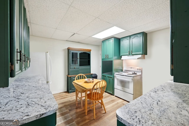 kitchen featuring light wood-type flooring, green cabinetry, white range with electric stovetop, and a paneled ceiling