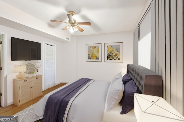 bedroom featuring ceiling fan and light hardwood / wood-style flooring