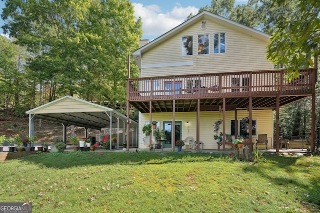 rear view of house with a yard, a carport, and a wooden deck