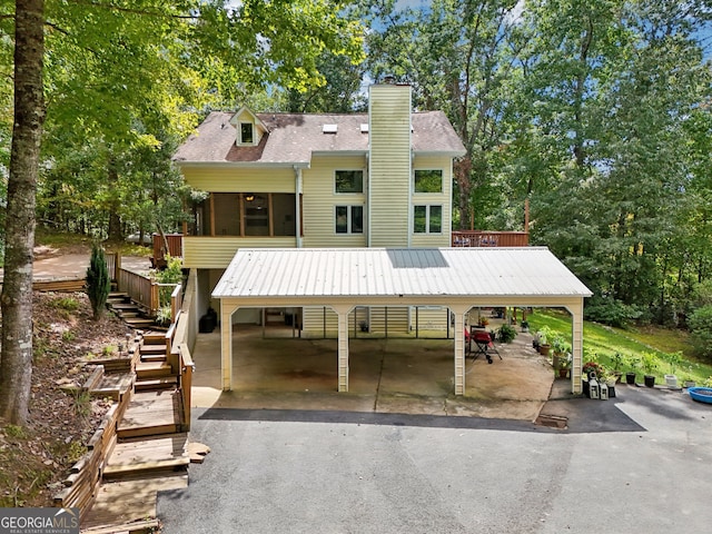 view of front of property featuring a wooden deck