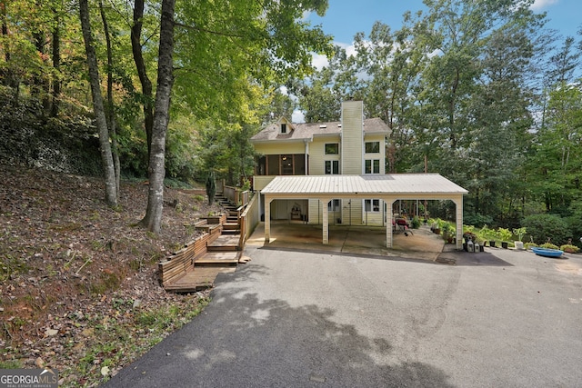 view of front of home with a carport