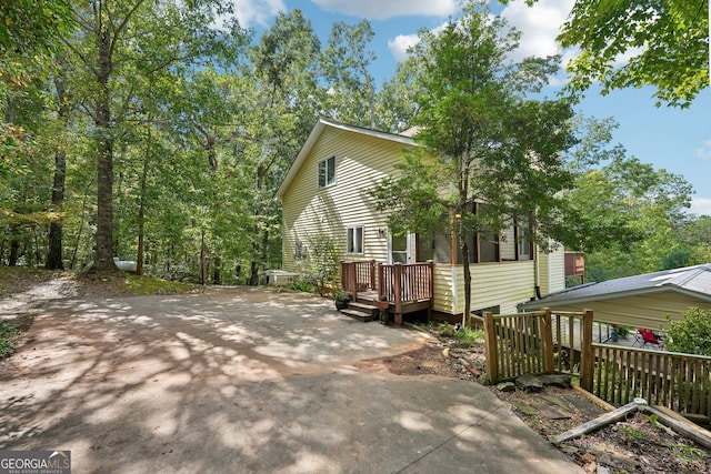 exterior space featuring a wooden deck