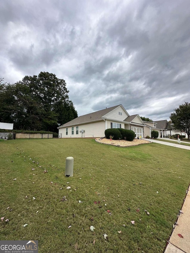 view of property exterior with a yard