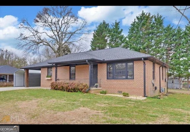 view of front facade with a carport and a front yard