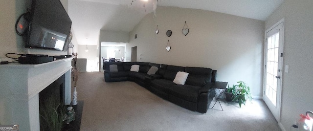 3364 Joseph Dr NW, Acworth, GA 30101 - living area featuring light colored carpet, vaulted ceiling, and a fireplace