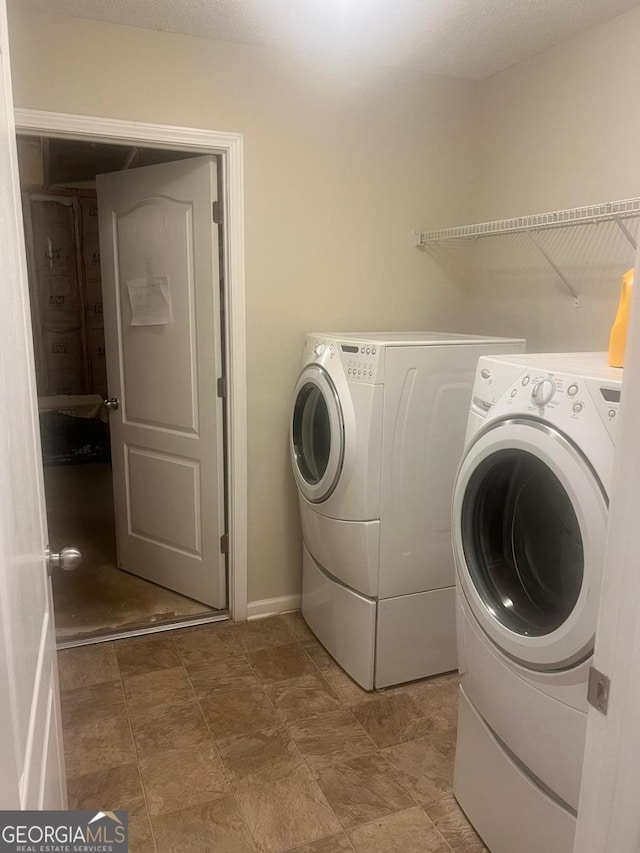 3364 Joseph Dr NW, Acworth, GA 30101 - laundry area featuring washer and clothes dryer and baseboards
