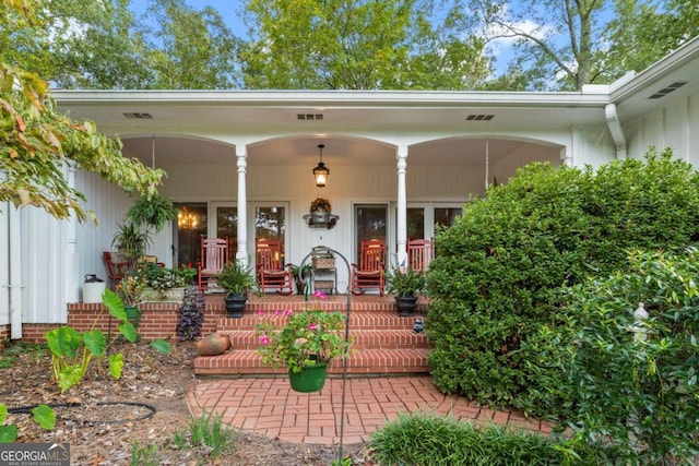 doorway to property with covered porch