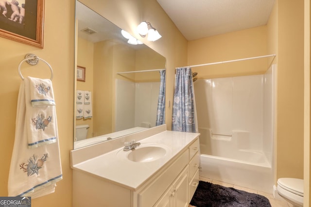 full bathroom with shower / bath combination with curtain, vanity, toilet, a textured ceiling, and tile patterned flooring